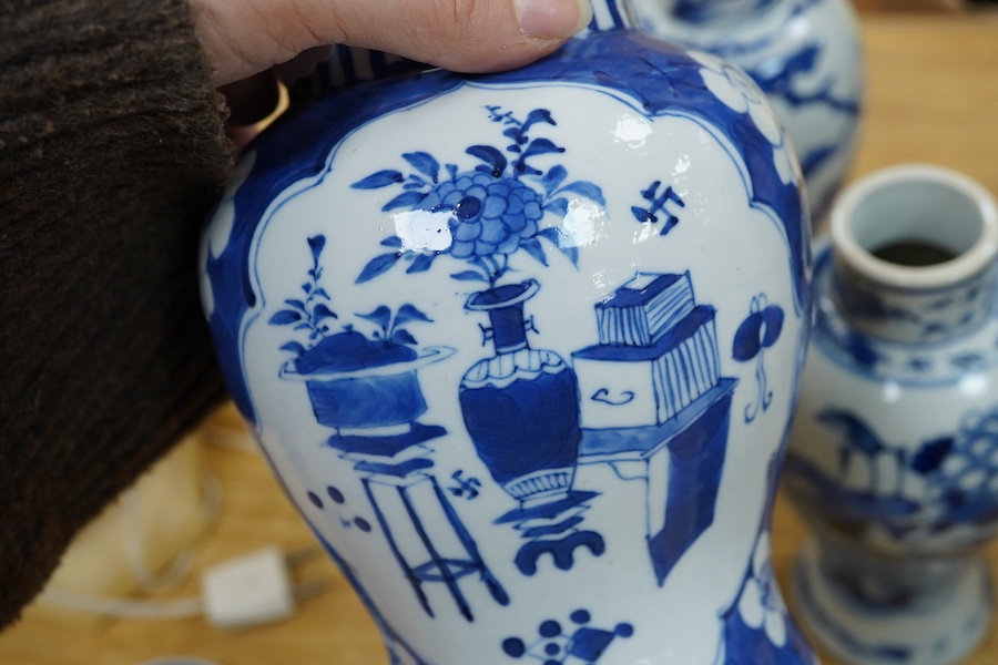 A pair of Chinese blue and white vases and a baluster jar and cover, largest 23cm high